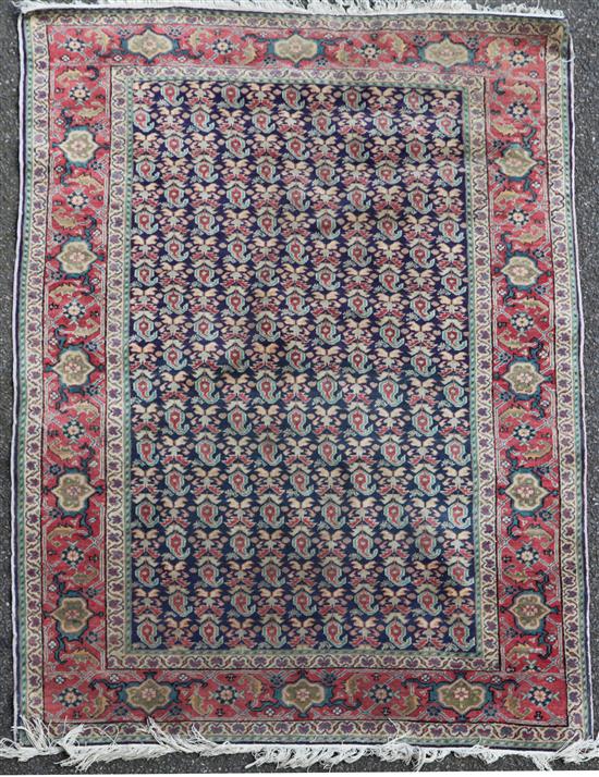 A central Persian rug, 5ft 7in by 3ft 11in.